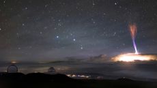 This otherworldly image, captured by a camera on a telescope at Maunakea, shows two lightning phenomenon: a red sprite and a blue jet.