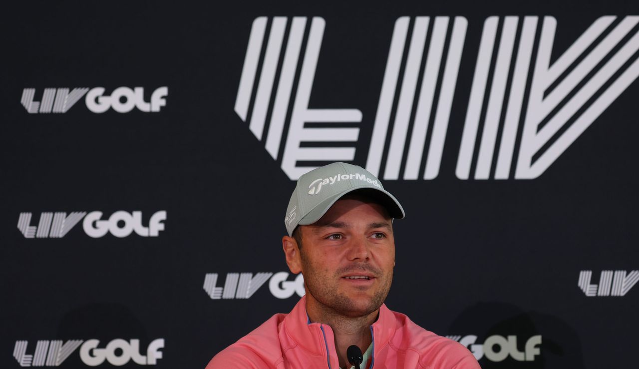 Martin Kaymer in front of a LIV Golf logo 