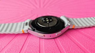 The Samsung Galaxy Watch 7's curvy new sensor array and orange home button accent