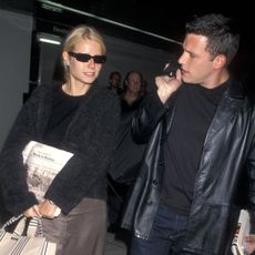 Gwyneth Paltrow carrying a Kate Spade Sam Bag in 1998 with Ben Affleck