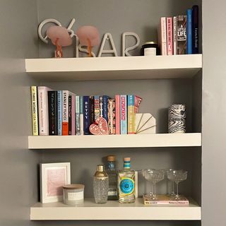 Living room built in shelves with books and accessories.