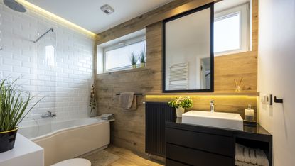 Modern small bathroom in stylish apartment white and wooden finishing