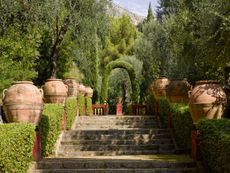 Allée des Jarres takes an easy, ascending route near the top of the garden. Les Colombières, France. Photographed by Will Pryce for Country Life.