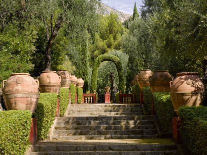 Allée des Jarres takes an easy, ascending route near the top of the garden. Les Colombières, France. Photographed by Will Pryce for Country Life.