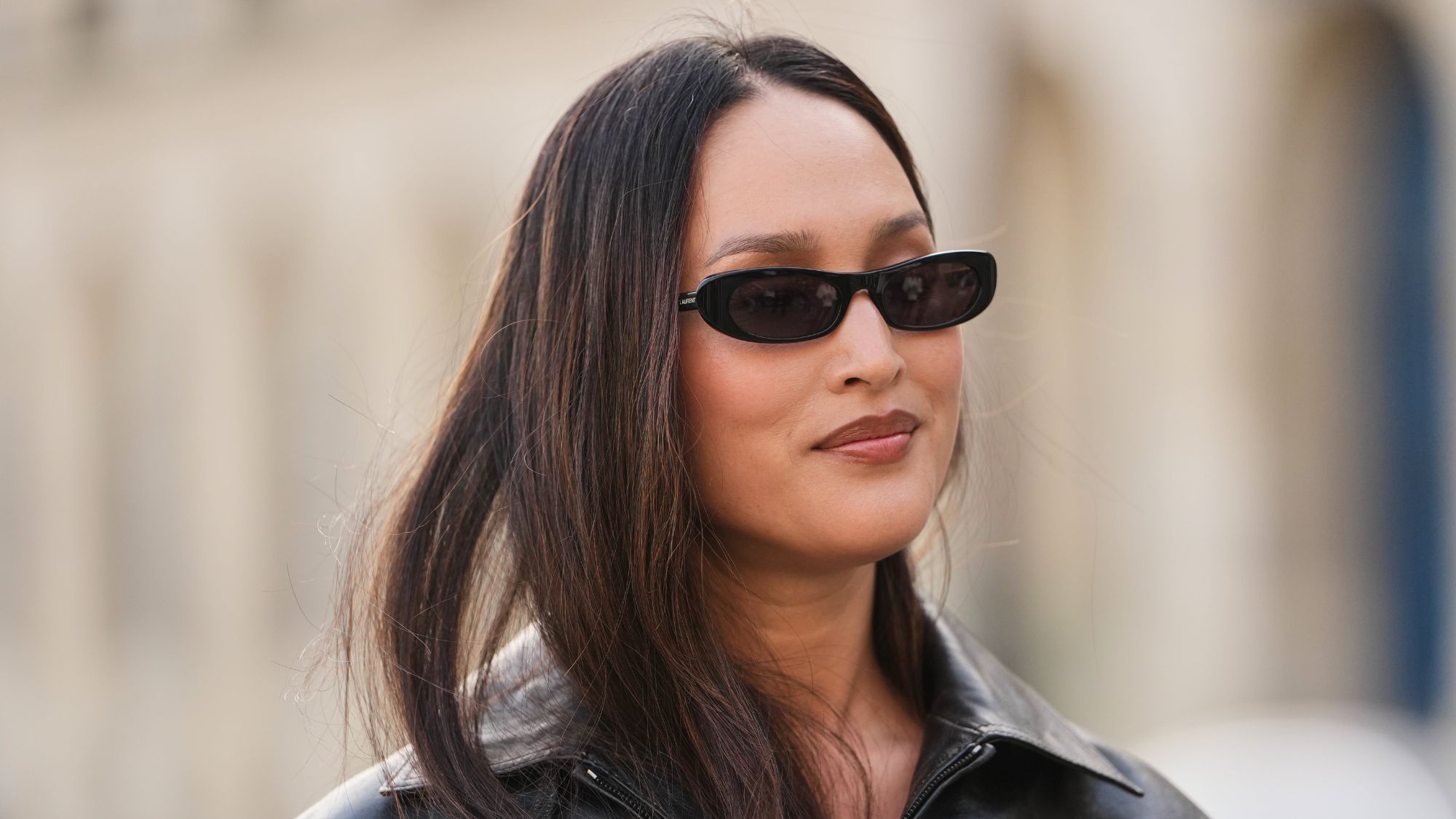 woman with brown hair wearing sunglasses