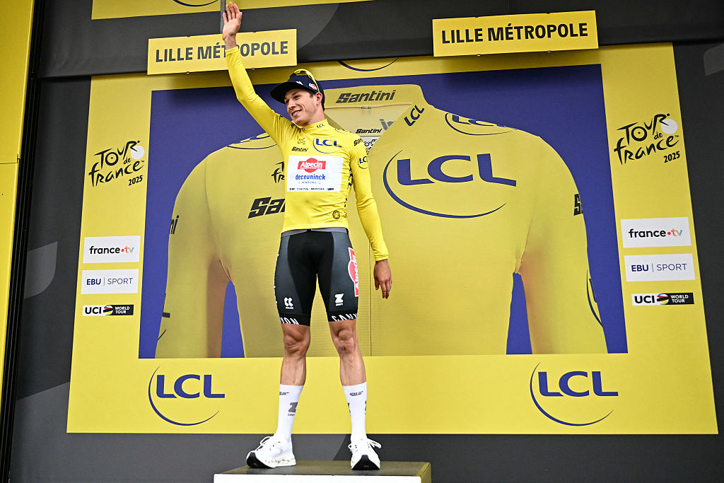 Jasper Philipsen on the yellow jersey podium at the Tour de France