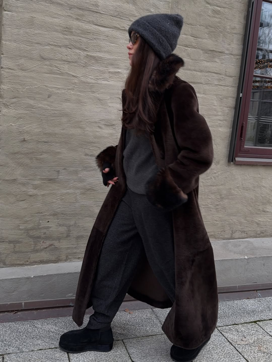 Annabel Rosendahl wears track pants with a faux fur coat.