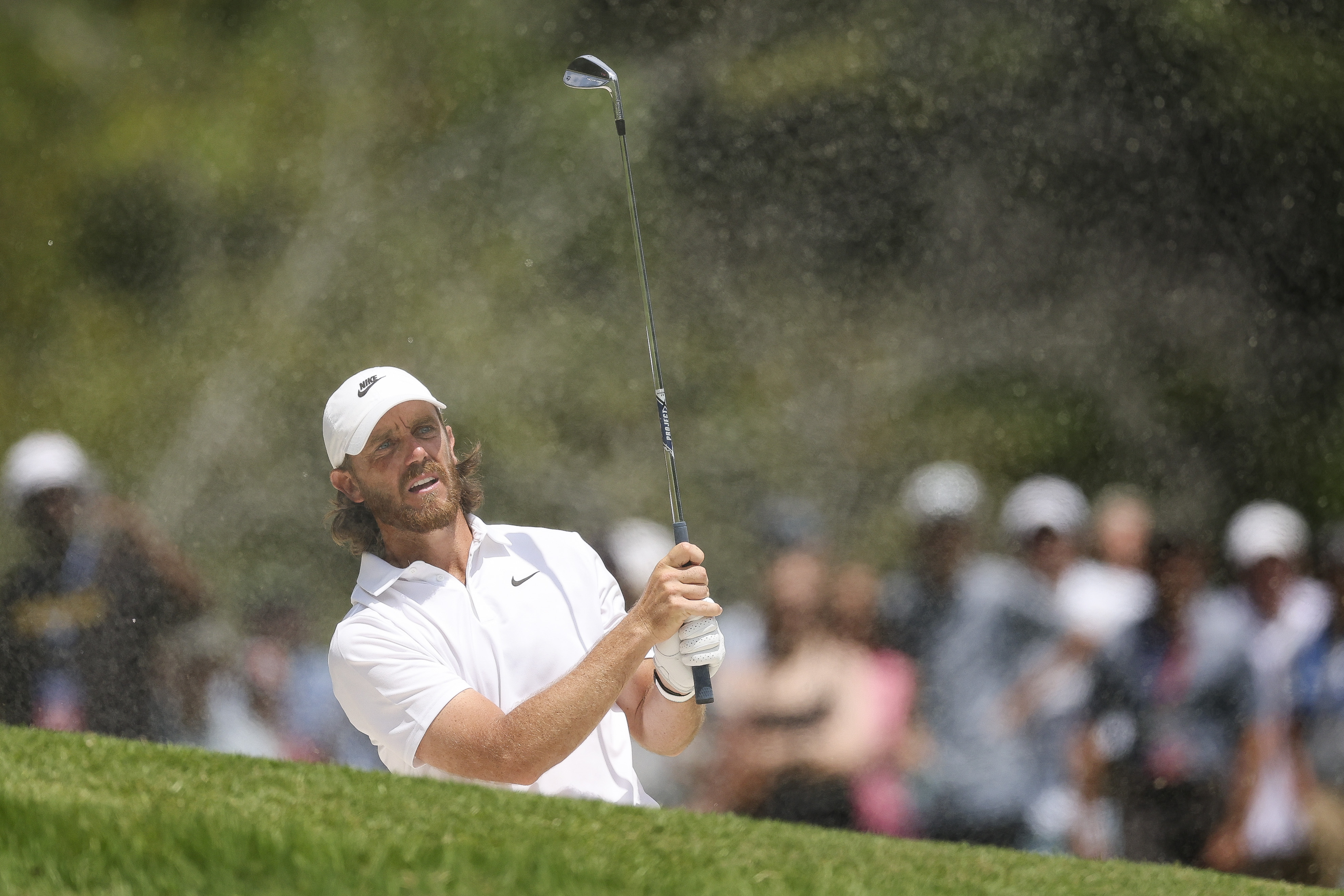 Tommy Fleetwood hits a wedge shot
