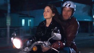 Zooey Deschanel and Jim Carrey ride a motorcycle in Yes Man.