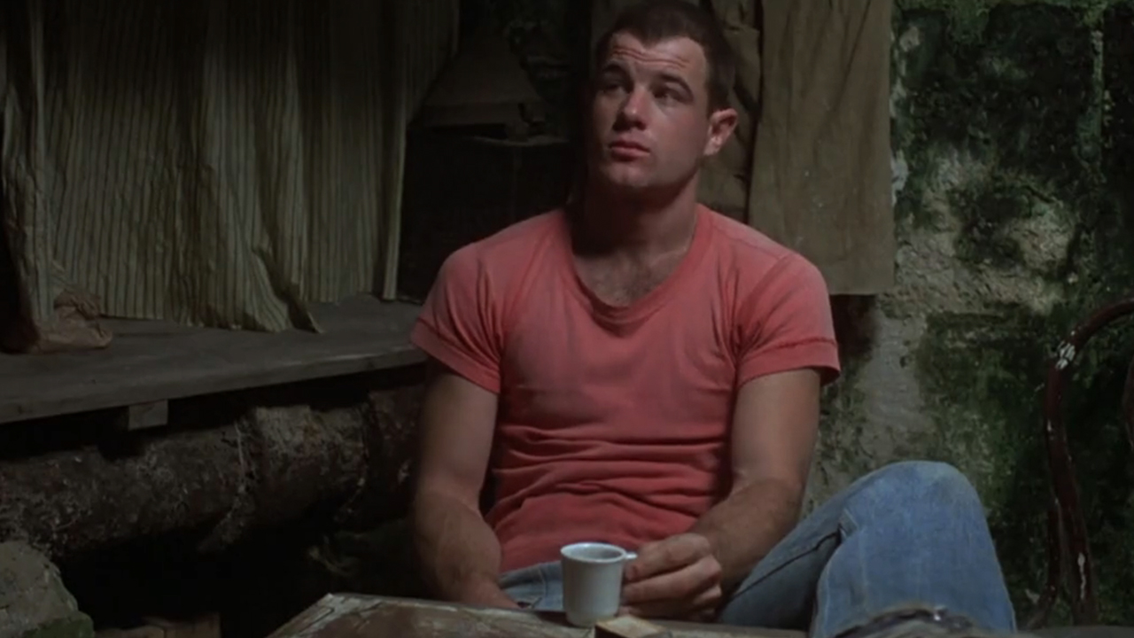 A man in a red shirt in a scene from “Midnight Express”