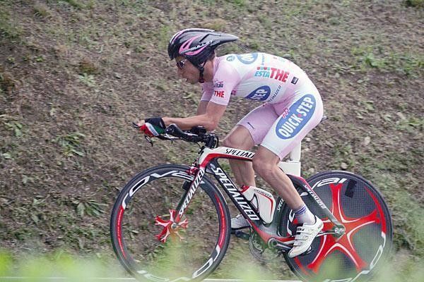 Visconti was well coordinated in pink with his red Specialized .
