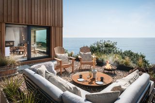 Patio overlooking the sea with firepit