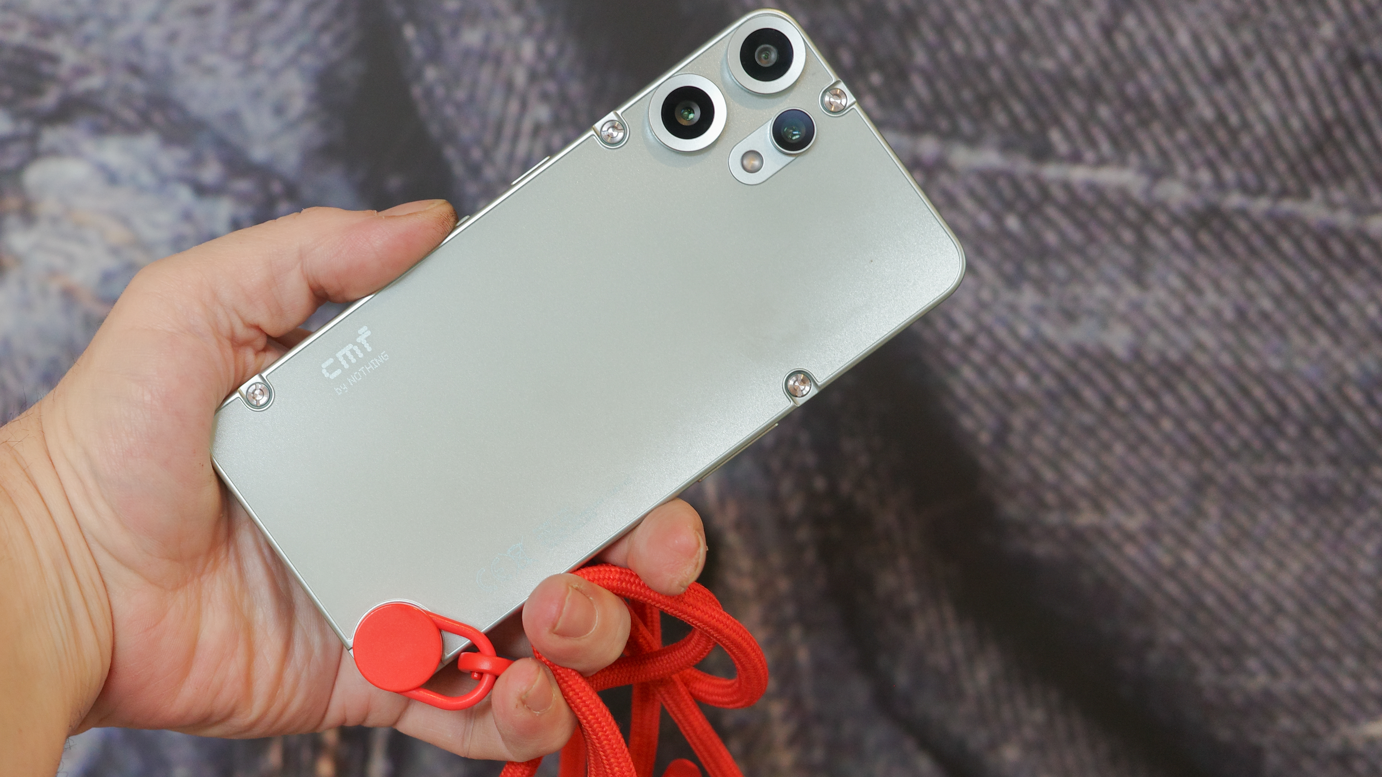 CMF Phone 2 Pro in light green showing back with exposed screws and cameras