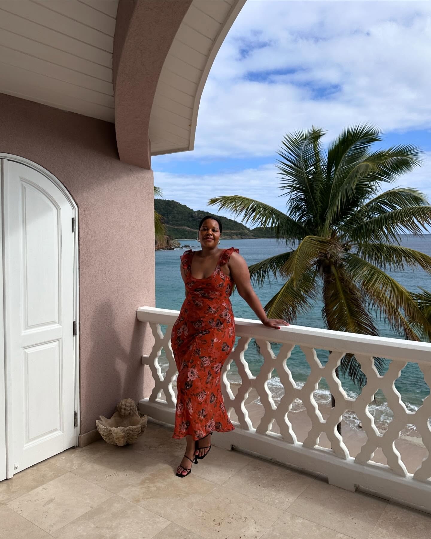 Karina wears floral dress