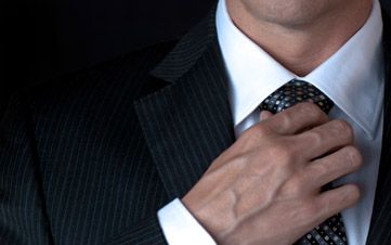 Businessman Adjusting Tie