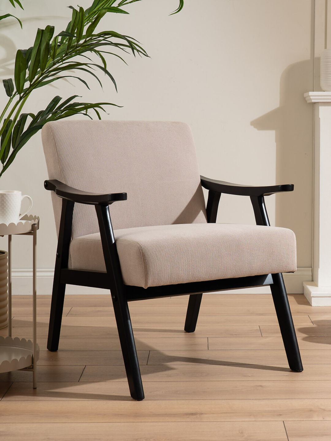 A mid-century modern black and beige chair from SO'HOME