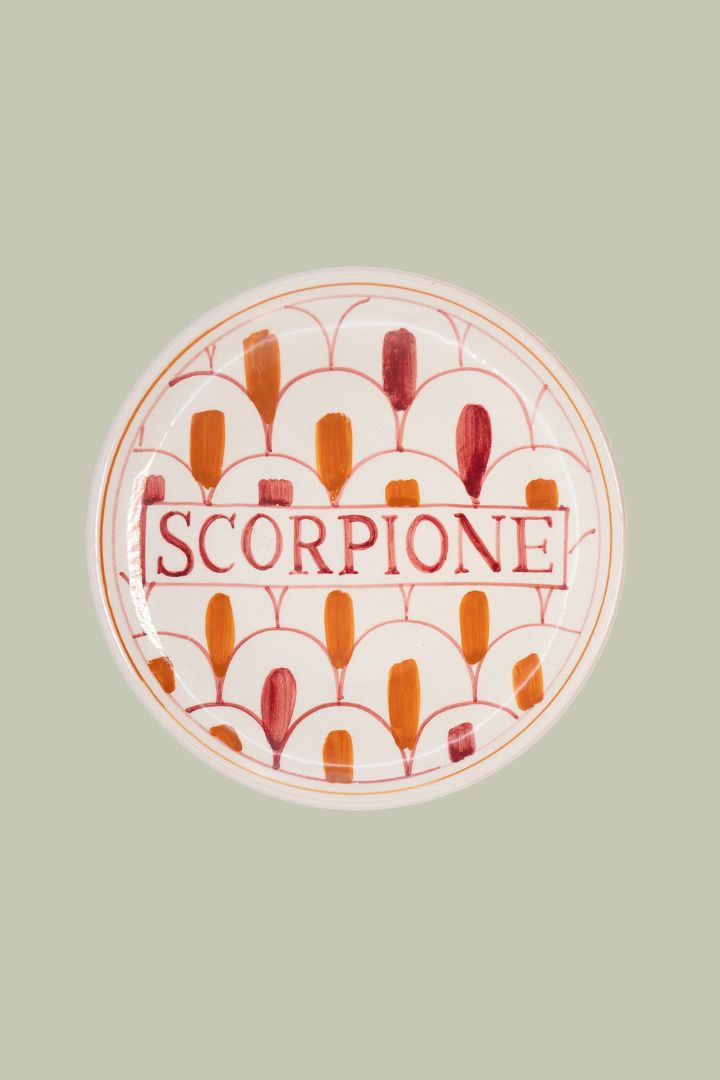 Scorpione Plate against pale green background.