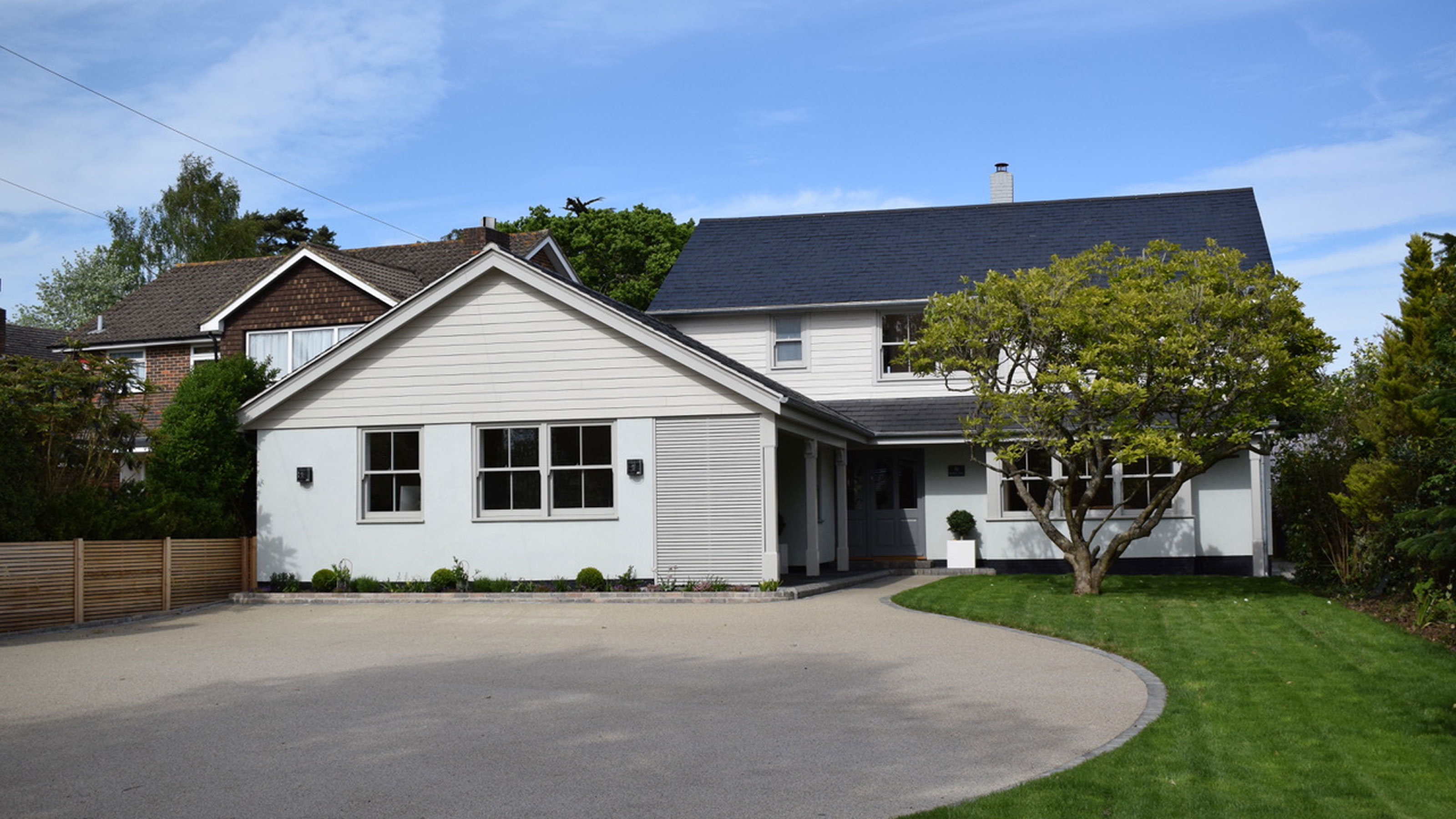 New England exterior makeover with garage conversion