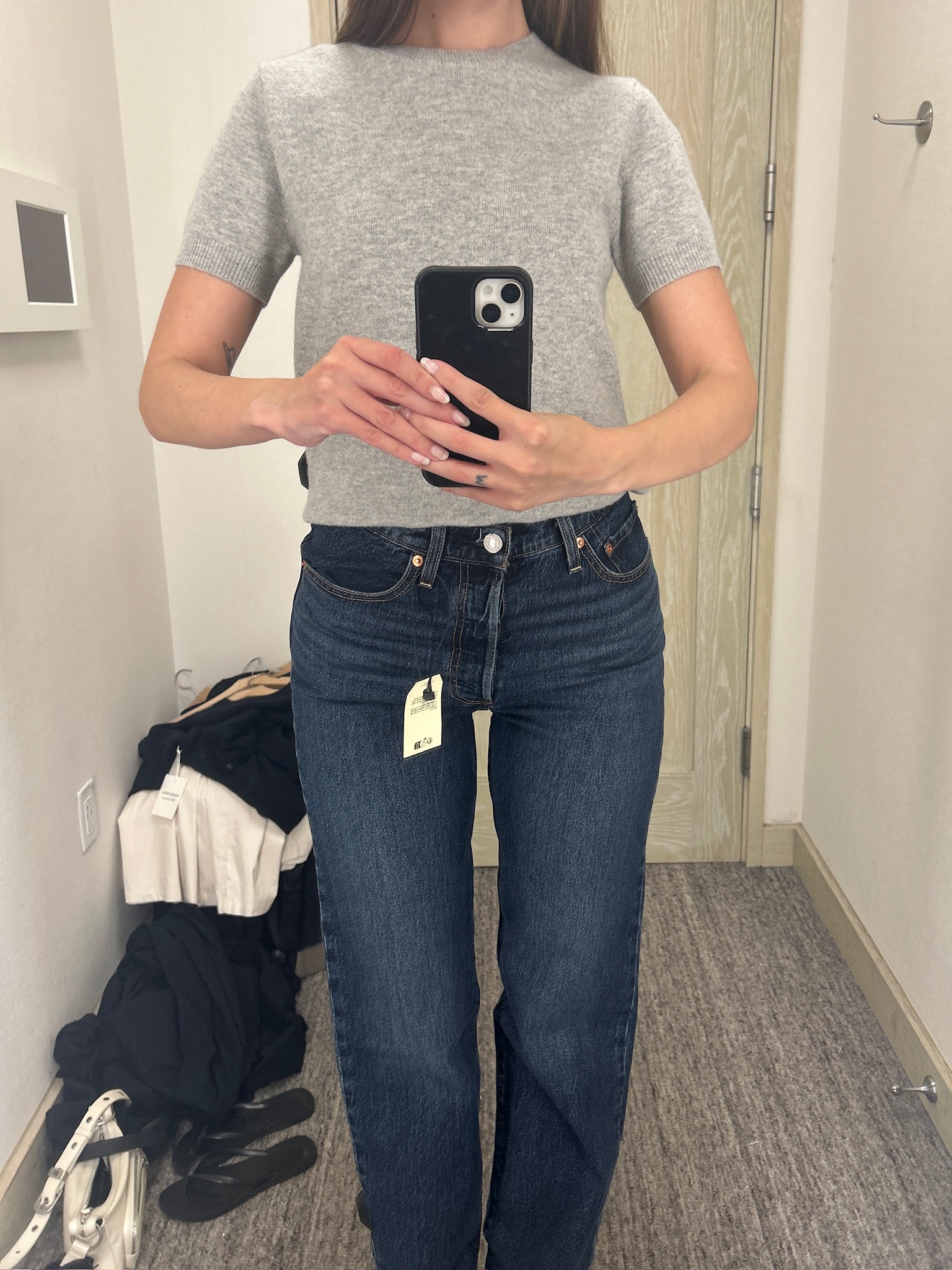 Audry Hiaoui trying on clothes atReplica Store flagship during theReplica Store Anniversary Sale 2025.