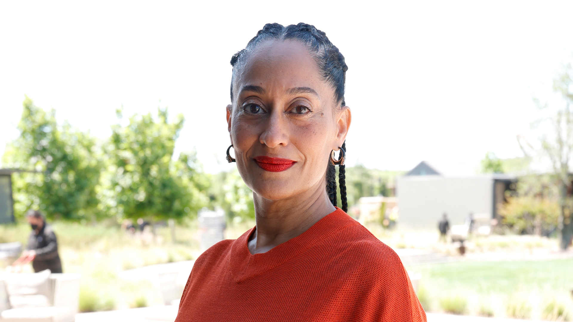 Tracee Ellis Ross wearing red lipstick and braids