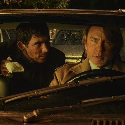 josh oconnor and daniel craig in a car together in a still from knives out wake up dead man