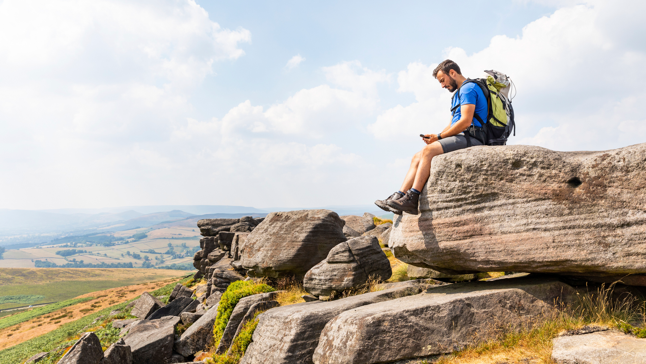 Hiker looking at his phone