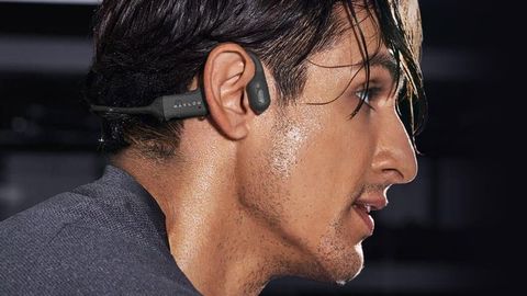 Man wearing Haylou PurFree BC01 headphones