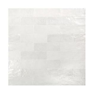 white glossy subway tiles laid in brick style