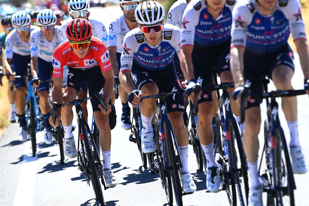 NAVACERRADA SPAIN SEPTEMBER 10 Remco Evenepoel of Belgium and Team QuickStep Alpha Vinyl Red Leader Jersey with teammates during the 77th Tour of Spain 2022 Stage 20 a 181km stage from Moralzarzal to Puerto de Navacerrada 1851m LaVuelta22 WorldTour on September 10 2022 in Puerto de Navacerrada Spain Photo by Tim de WaeleGetty Images