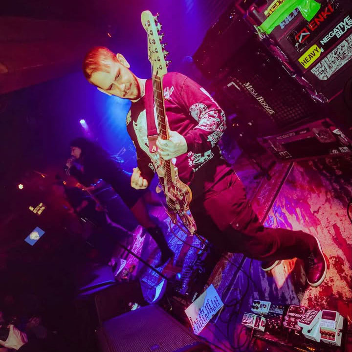 Filth Is Eternal guitarist Brian McClelland plays guitar onstage