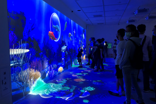 Visitors enjoying lifelike projections using Christie visual solutions at the newly opened Xpark Aquarium