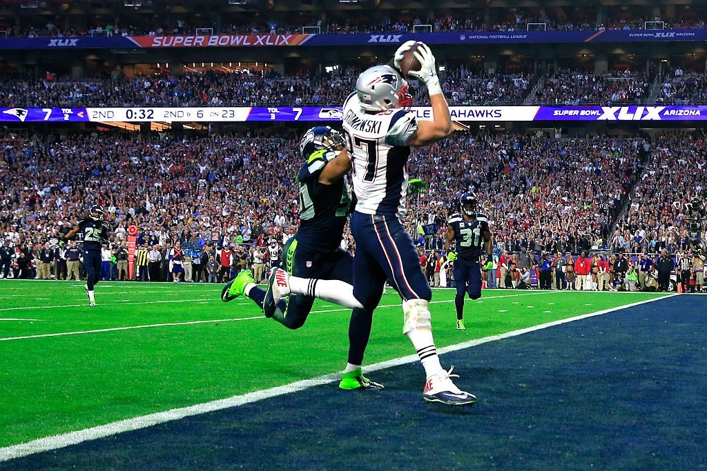 Rob Gronkowski of the New England Patriots catches a touchdown pass on a natural-grass turf against K.J. Wright of the Seattle Seahawks during the Super Bowl on Feb. 1, 2015 in Glendale, Arizona.