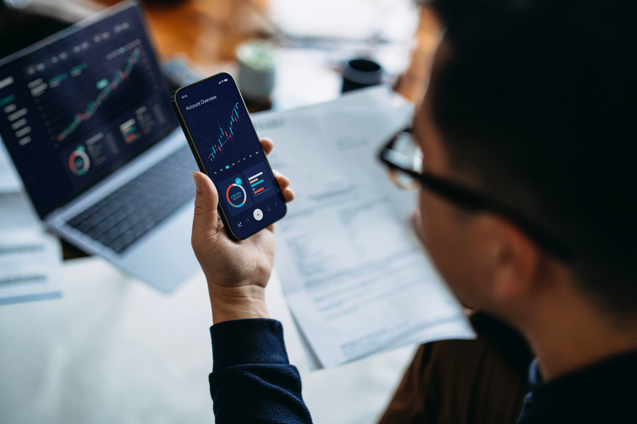 Young man managing finance and investment online
