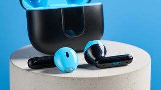 the h2o audio ript-lite earbuds in black and blue, photographed against a blue background, for both working out and everyday use
