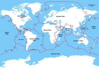 a map of earth with red lines throughout to show the locations of tectonic plates