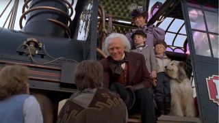 Christopher Lloyd and Mary Steenburgen stand with their family on a floating train in Back To The Future: Part III.