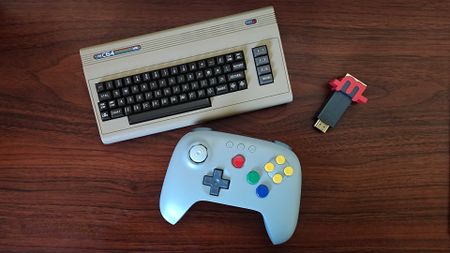 C64 Mini, 8BitDo 64 controller, and mClassic retro upscaler on a wooden desk