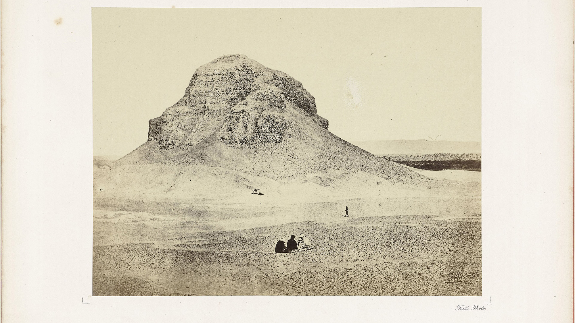 An older photograph if a dirt hill