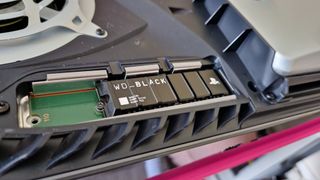 WD Black SN850P close up in a PS5's SSD tray