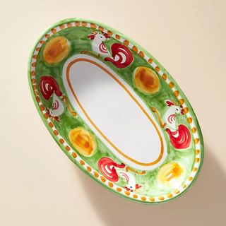 Green, red and yellow hand painted platter with chicken motif