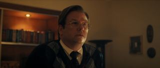 Dallas Roberts as Dr. Jerome Oziel in episode 201 of Monsters: The Lyle And Erik Menendez Story.