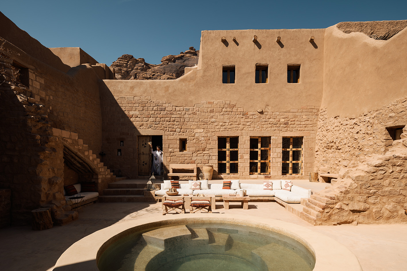 views of mud brick house with warm hues in desert building style, Bin Nouh's Courtyard House by Shahira Fahmy