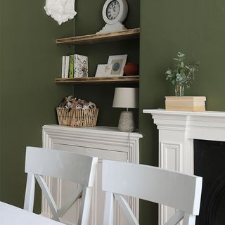 green dining room with alcove shelves