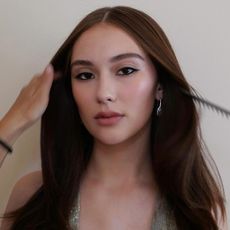 Lola Tung with brunette hair