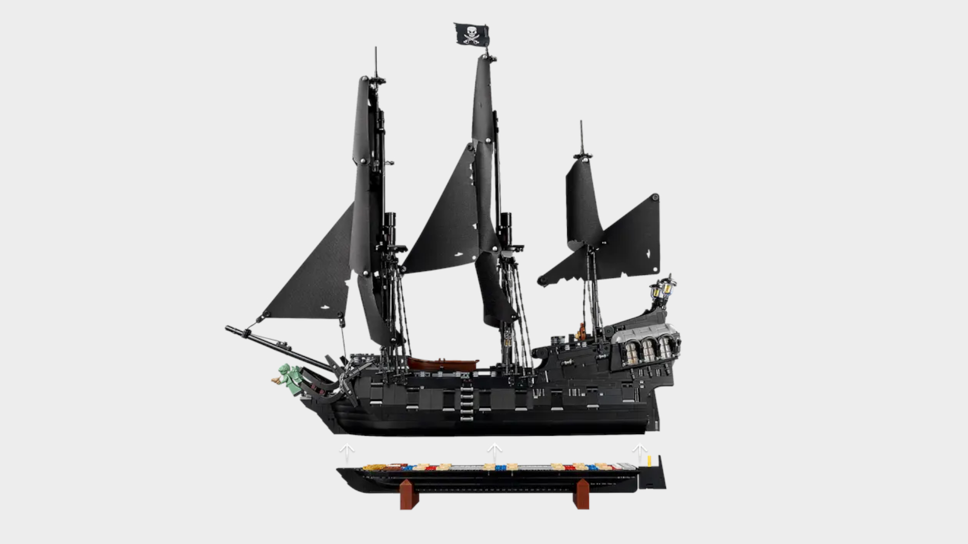 Lego Captain Jack Sparrow's Pirate Ship set with the bottom detached, all against a plain background