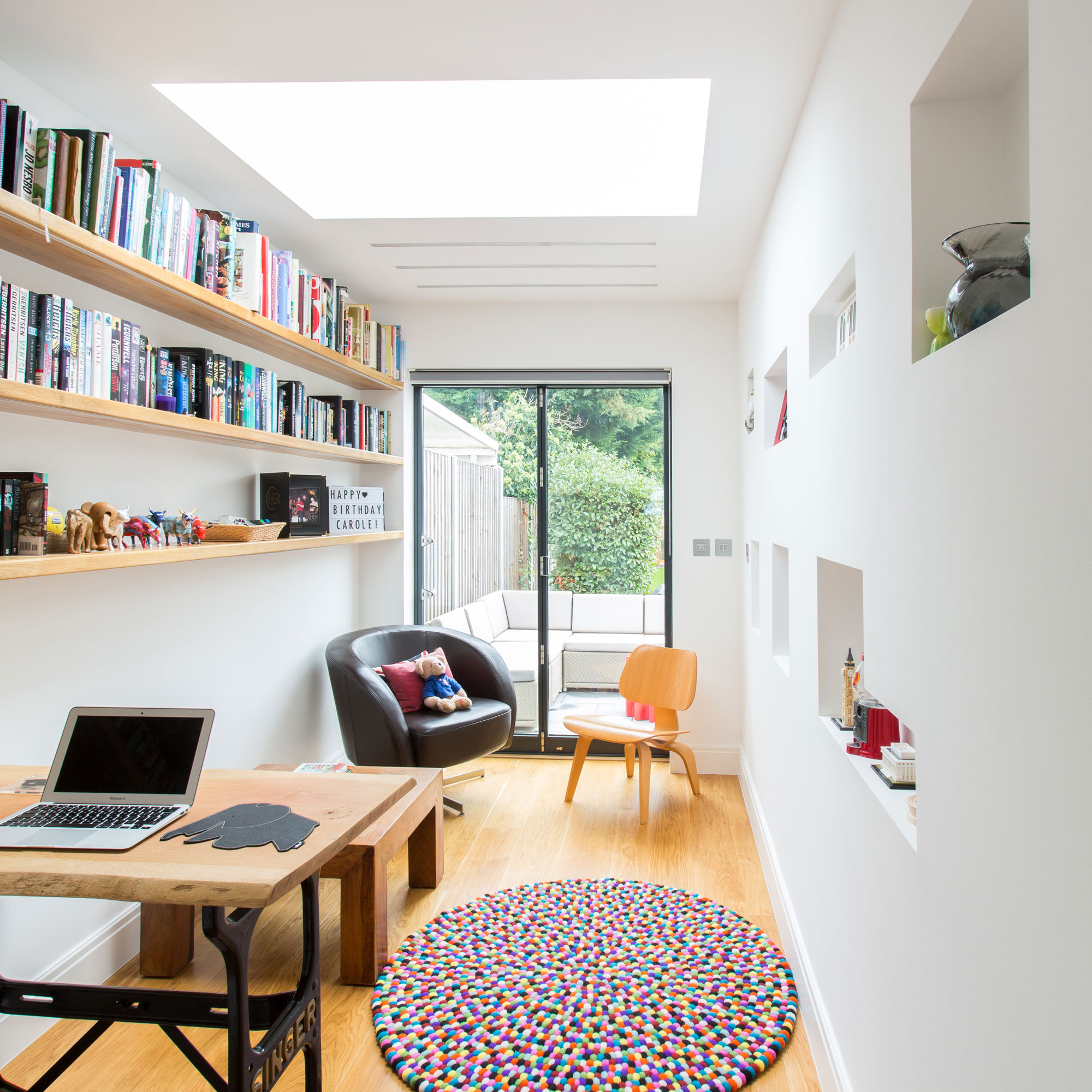 garage conversion home office with wooden flooring and patio doors