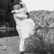 black and white photo of wedding couple hugging