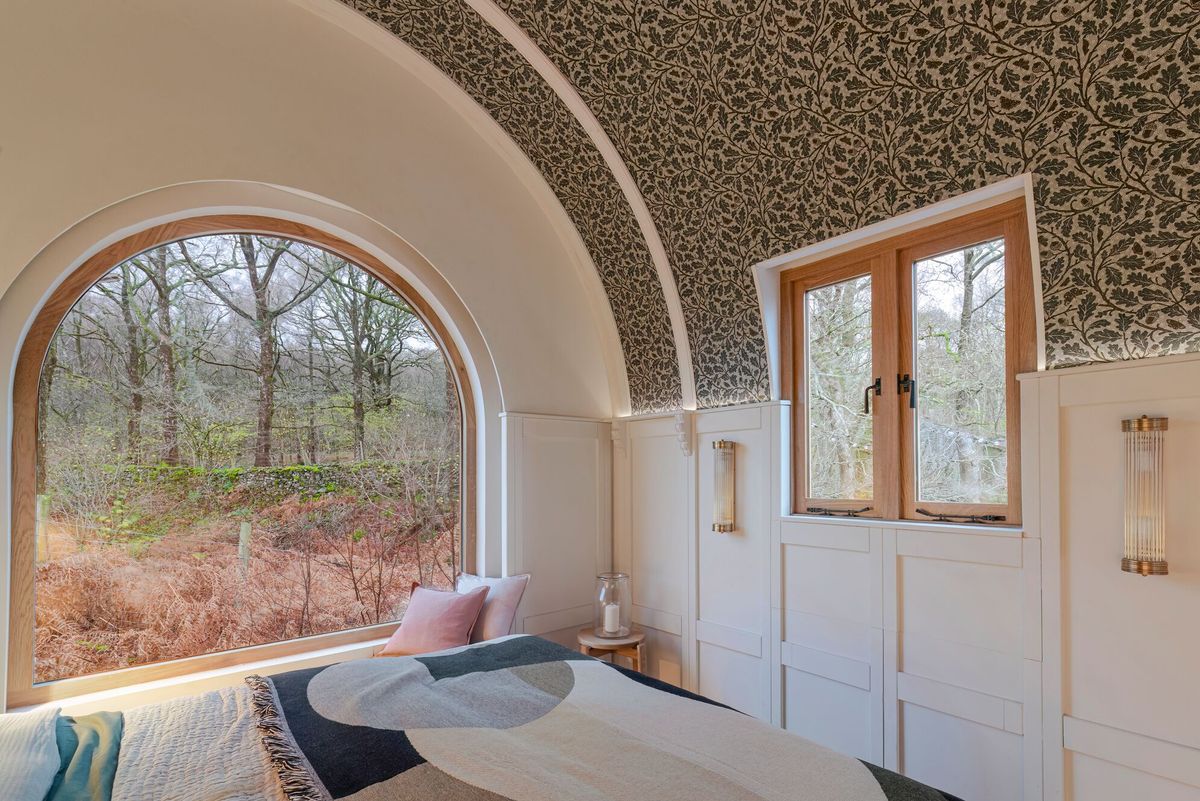 The barrel roof and large window inside the mobile caravan