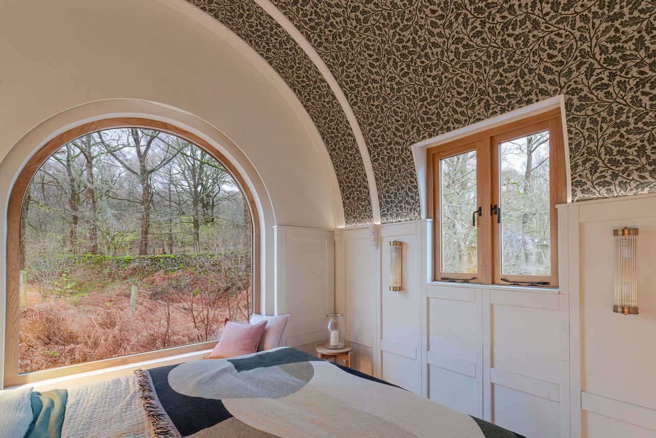 The barrel roof and large window inside the mobile caravan