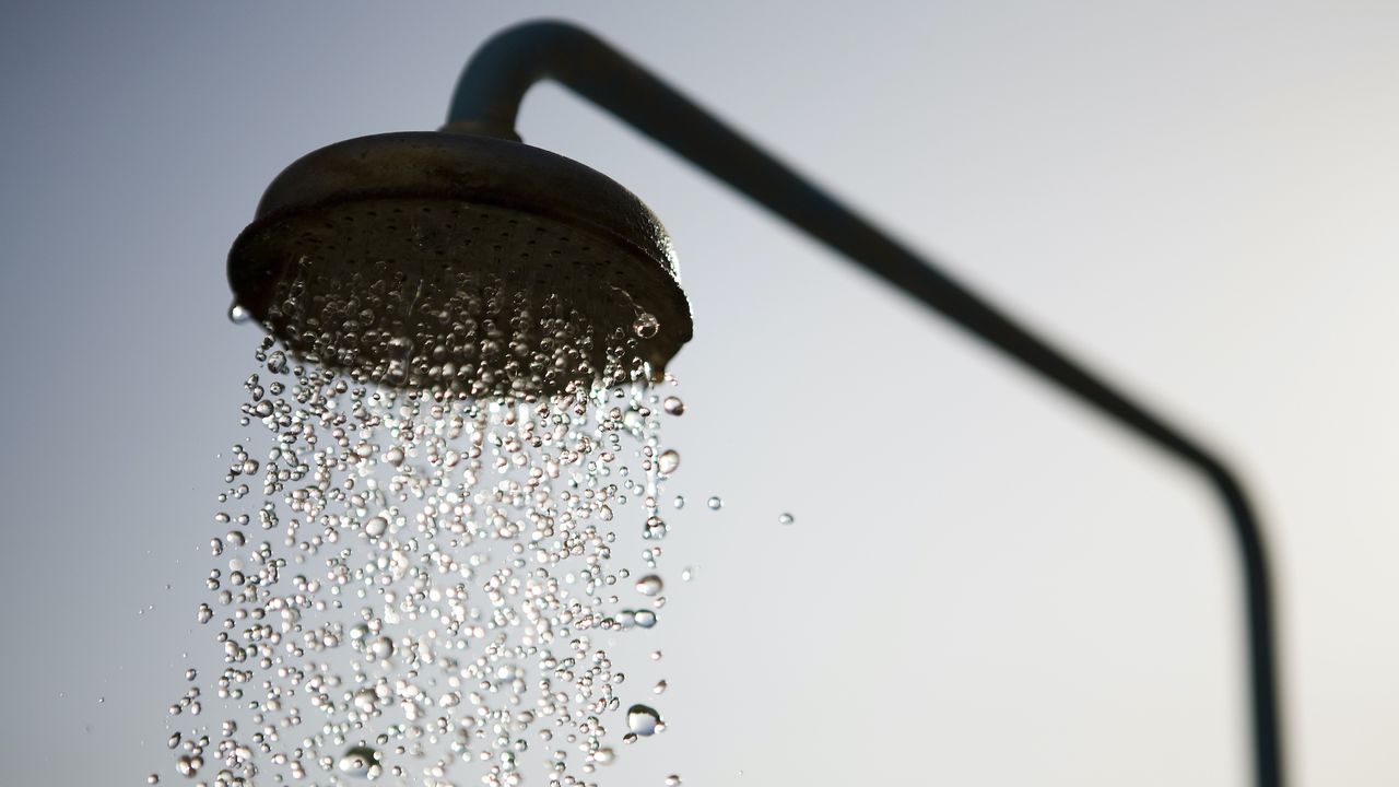 outdoor shower faucet with water running, are cold showers good for you